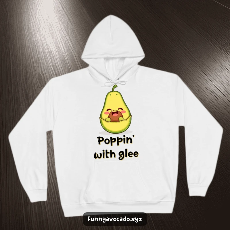 Funny hoodie featuring a giggling avocado character popping out of its peel like a jack-in-the-box, bringing cozy laughs.