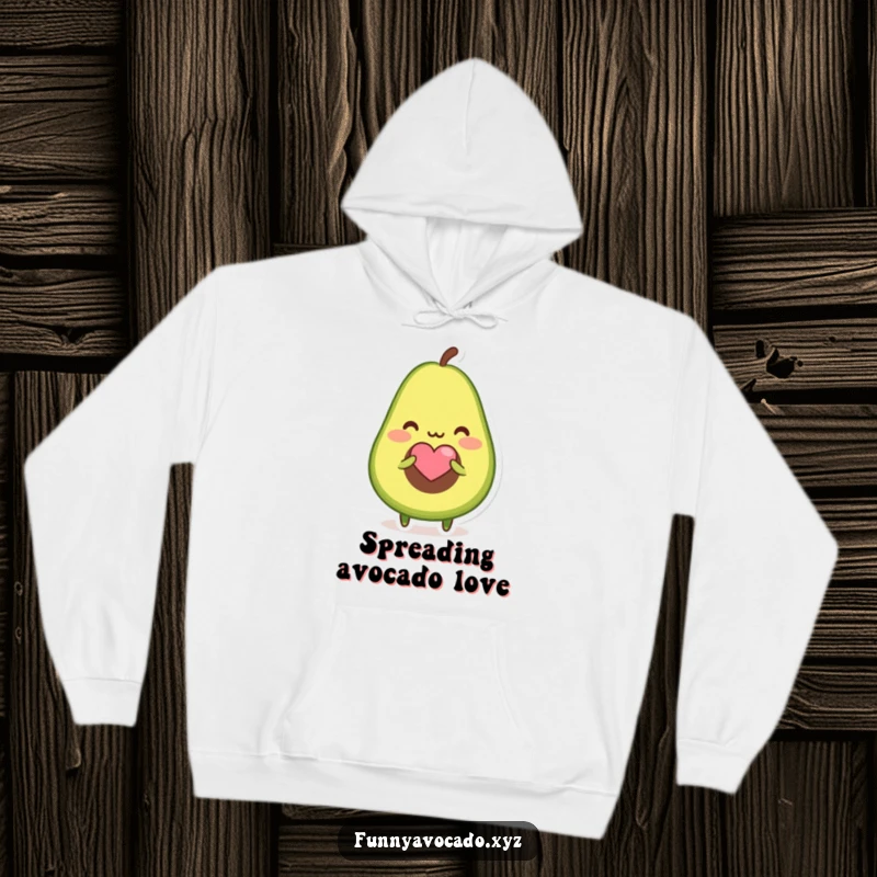 Funny hoodie featuring a blushing avocado character offering a tiny heart-shaped seed, perfect for cozy affection.